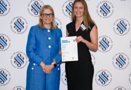 Founder of W & Co. Lawyers, Zoe Whetham, accepting award from Chair Person of the Specialist Accreditation Board, Jacqueline Dawson.